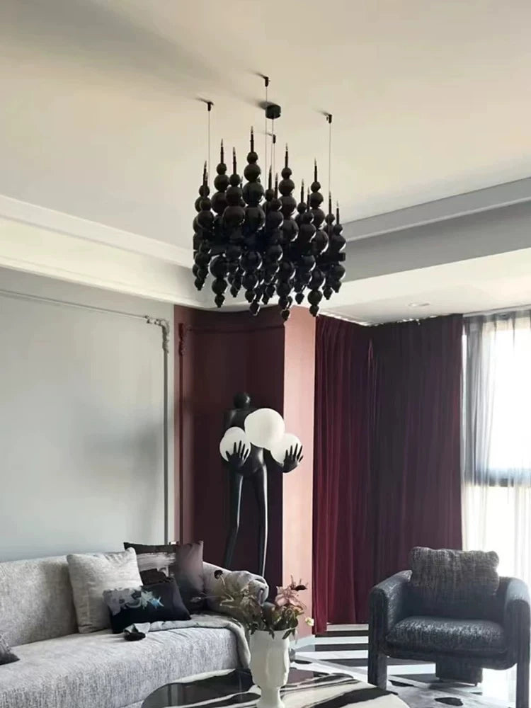 Black chandelier from MC THE BLACK DIAMOND for luxury living room lighting, featuring elegant design and multiple light fixtures.