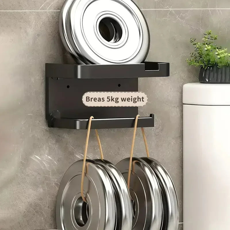 Plastic toilet paper holder by MC THE BLACK DIAMOND, wall-mounted bathroom storage for toilet paper rolls.