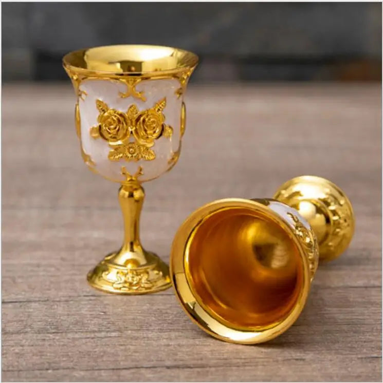 Gold and silver decorative cups from MC The Black Diamond drinkware set, featuring elegant design and shiny finishes.