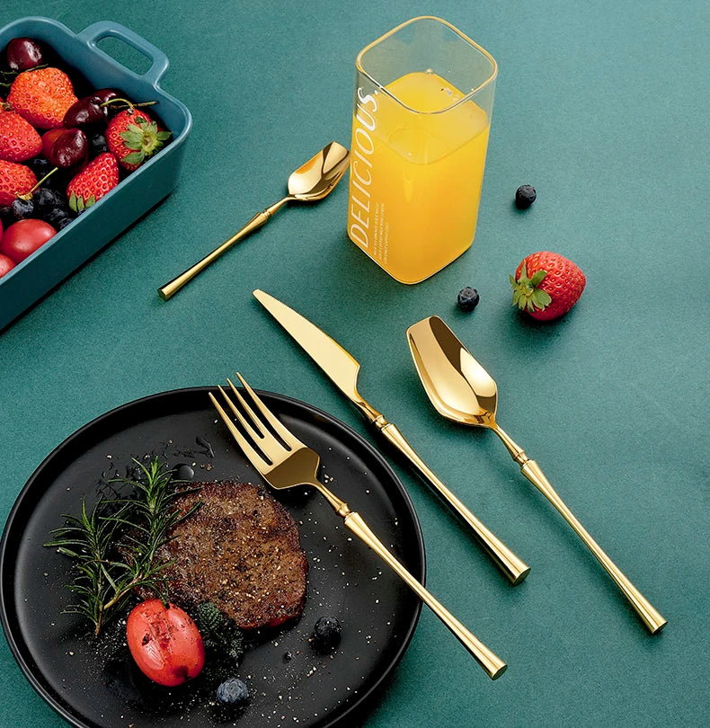 Mirror matte stainless steel black, gold, and silver dinnerware set with sleek, modern design and reflective finish.