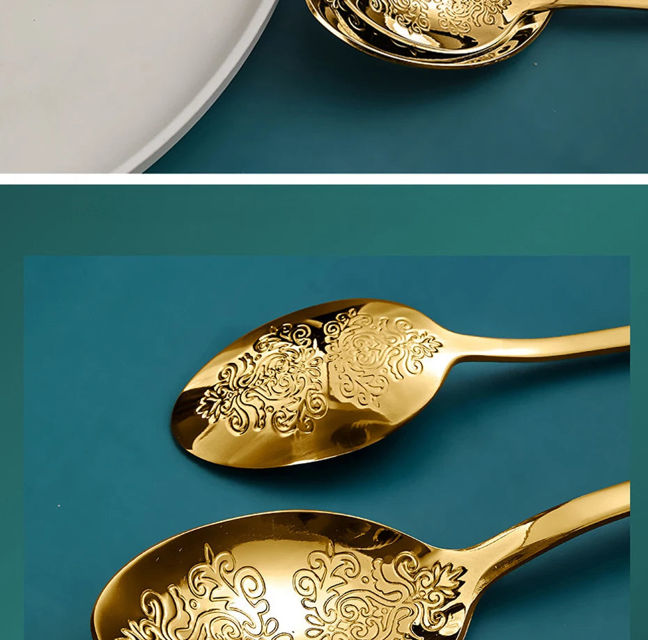Stainless steel gold flatware set by MC THE BLACK DIAMOND with forks, knives, and spoons arranged on a dining table.