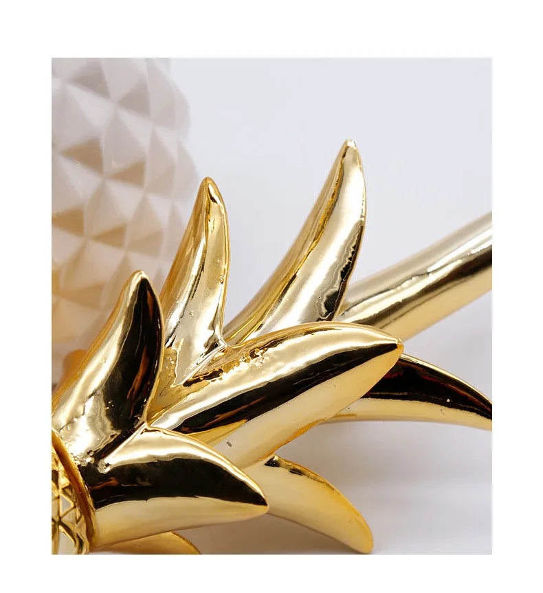 Golden ceramic pineapple decor by MC THE BLACK DIAMOND, ideal for home, living room, porch, or wedding decoration.