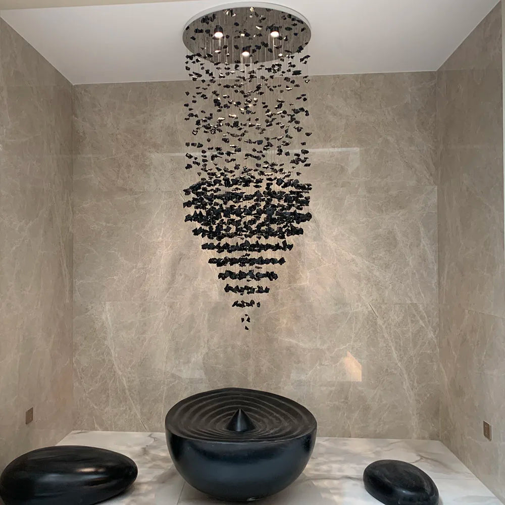Modern stone crystal LED chandelier by MC THE BLACK DIAMOND, large luxury staircase and living room lighting fixture with elegant design.