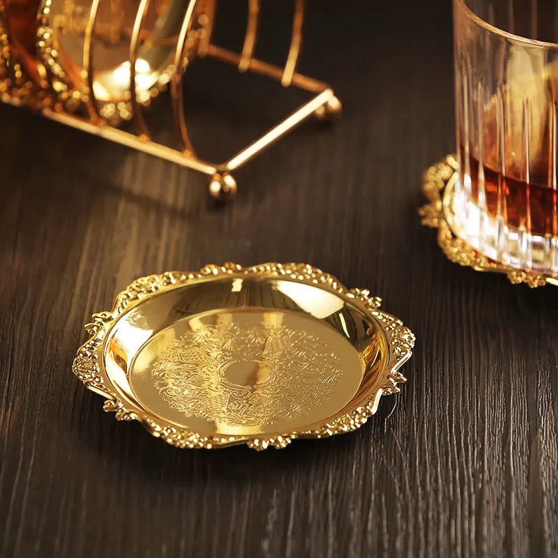 Golden metal cocktail coaster featuring classical design by MC THE BLACK DIAMOND, perfect for protecting surfaces during drinks.