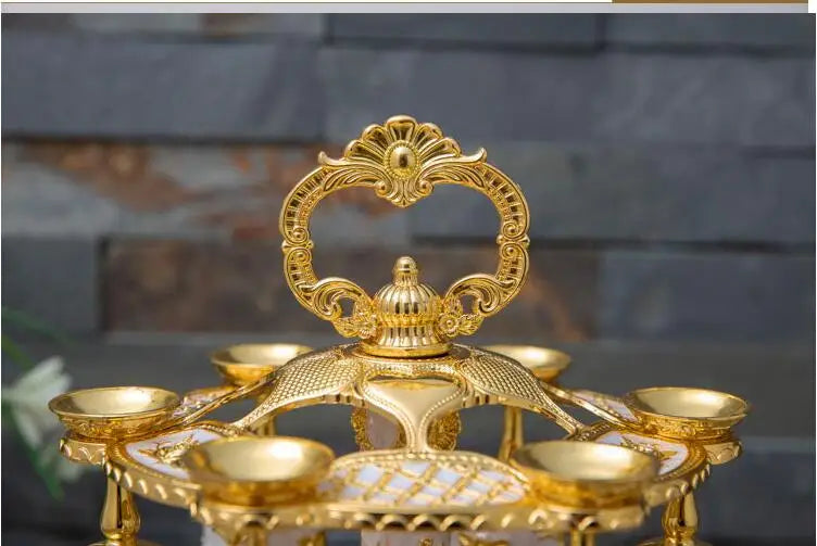 Set of gold and silver decorative drinkware cups from MC THE BLACK DIAMOND, elegant metal cup set for special occasions.