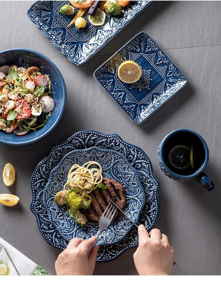 Blue retro relief ceramic dinnerware set by MC THE BLACK DIAMOND, includes stylish plates and bowls with vintage design.