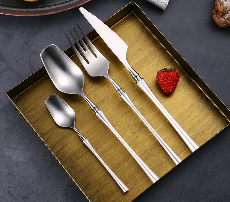 Matte stainless steel dinnerware set with black, gold, and silver finishes from 𝕄𝕔 𝕿𝕙𝕖 𝔹𝕝𝕒𝕔𝕜 𝔻𝕚𝕒�