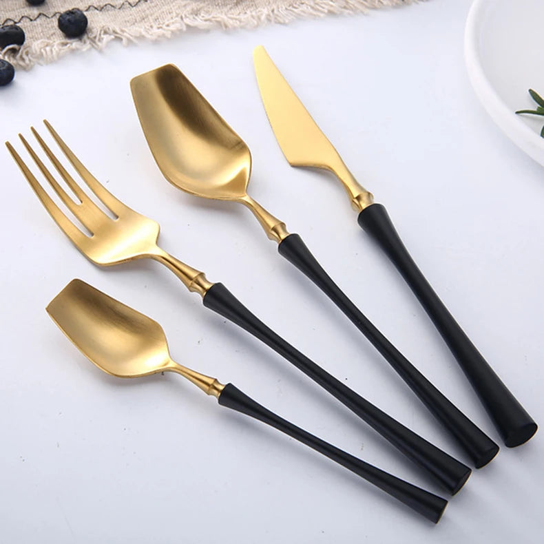 Matte stainless steel dinnerware set with black, gold, and silver finishes, featuring sleek, modern design by 𝕄𝕔 𝕋𝕙𝕖 𝔹𝕝𝕒𝕔𝕜 𝔻�