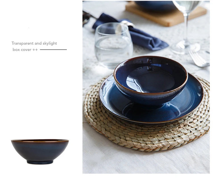 Deep blue ceramic dinnerware set by MC THE BLACK DIAMOND, includes plates and bowls with a sleek, modern design.