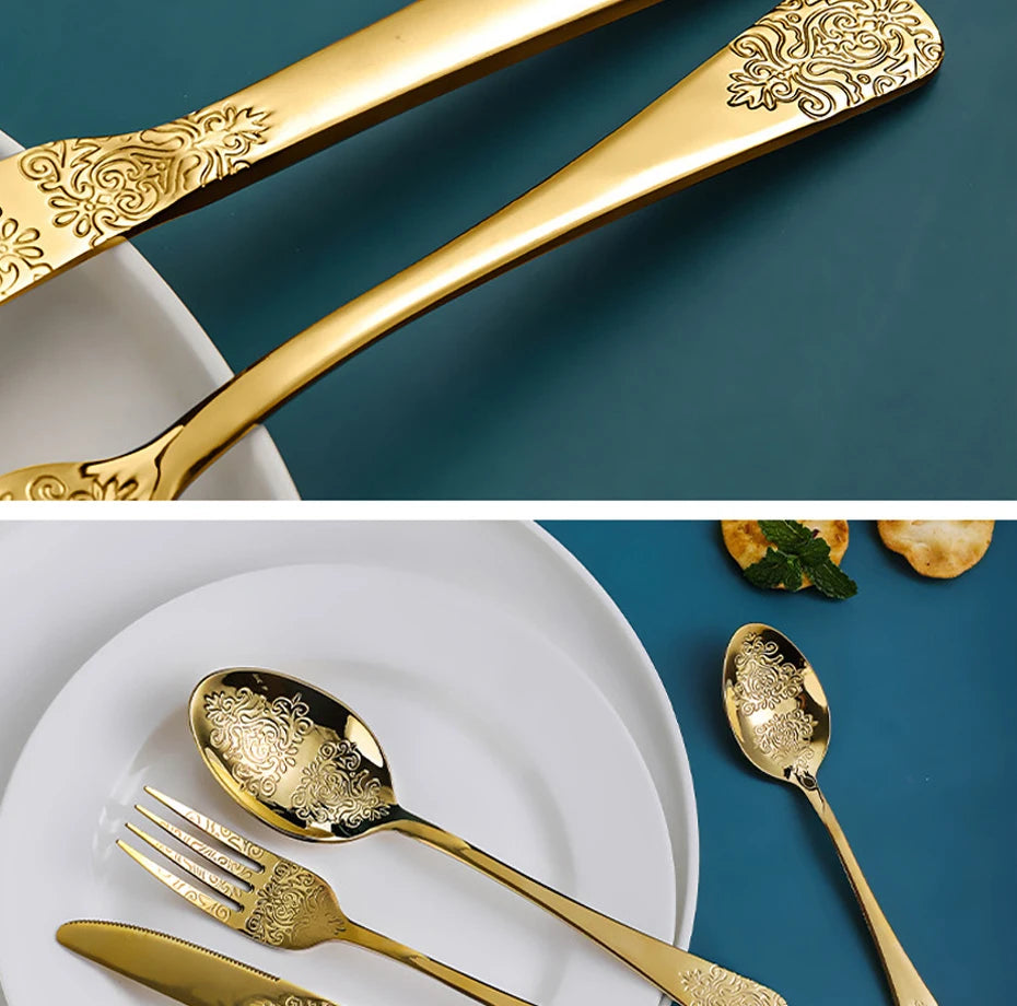 Stainless steel gold flatware set by MC THE BLACK DIAMOND, including forks, knives, and spoons arranged on a dining table.