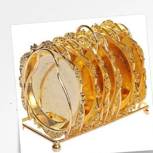 Golden metal cocktail coaster with classical design from MC THE BLACK DIAMOND, featuring intricate detailing for elegant drink presentation.