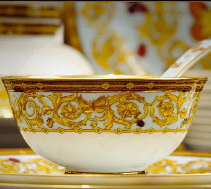 Golden Butterfly dinnerware set by MC THE BLACK DIAMOND featuring elegant plates and bowls with butterfly motifs.
