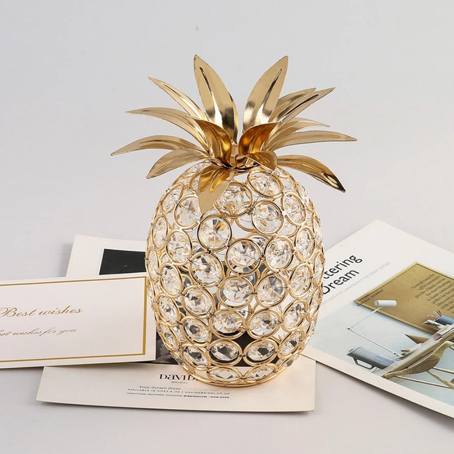 Gold crystal pineapple tabletop centerpiece for home decor by MC THE BLACK DIAMOND, featuring a shiny gold finish and detailed crystal accents.