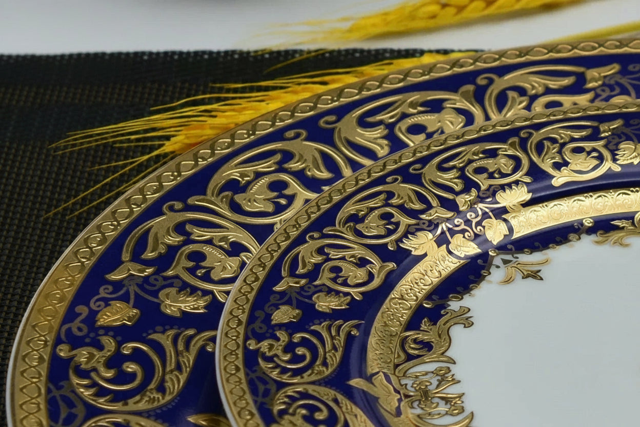 Royal Style embossed gold rim ceramic dinner set by MC THE BLACK DIAMOND, featuring elegant plates and bowls with intricate gold details.