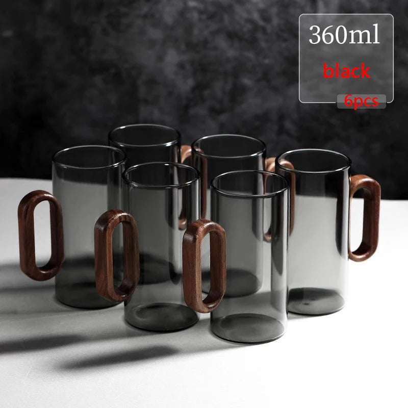 Glass mug with wooden handle from MC THE BLACK DIAMOND drinkware set, featuring a clear glass and warm wooden handle.