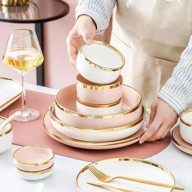 Set of bright white and pink porcelain plates with gold accents from MC THE BLACK DIAMOND for kitchen use, featuring elegant design.