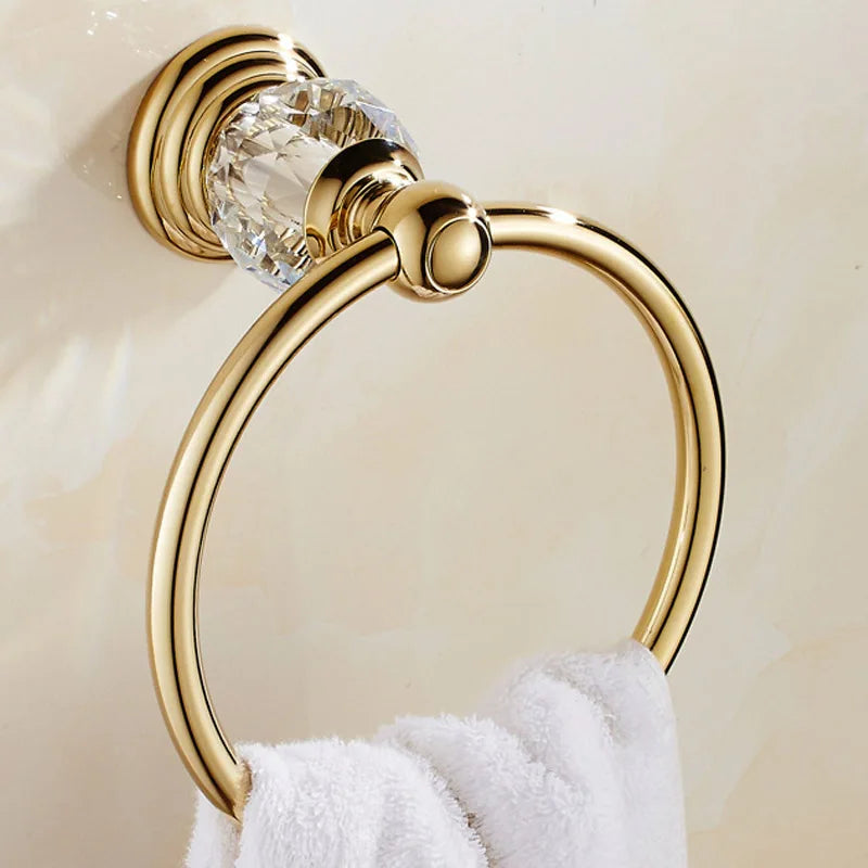 Luxury gold polished brass bathroom accessories set including soap dispenser, toothbrush holder, and tumbler by MC THE BLACK DIAMOND