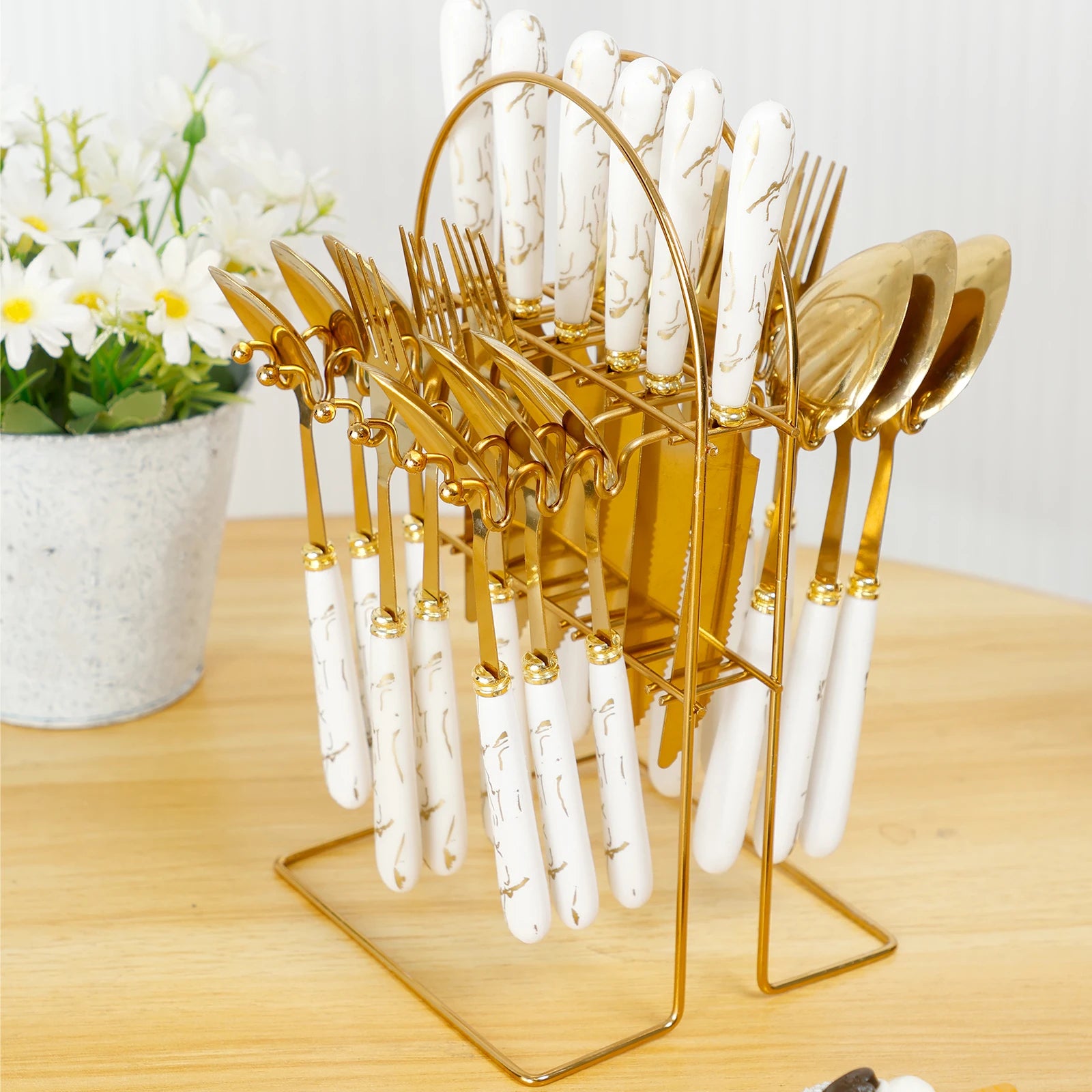 Stainless steel flatware set with holder by MC THE BLACK DIAMOND, includes knives, forks, and spoons arranged in a stylish holder.
