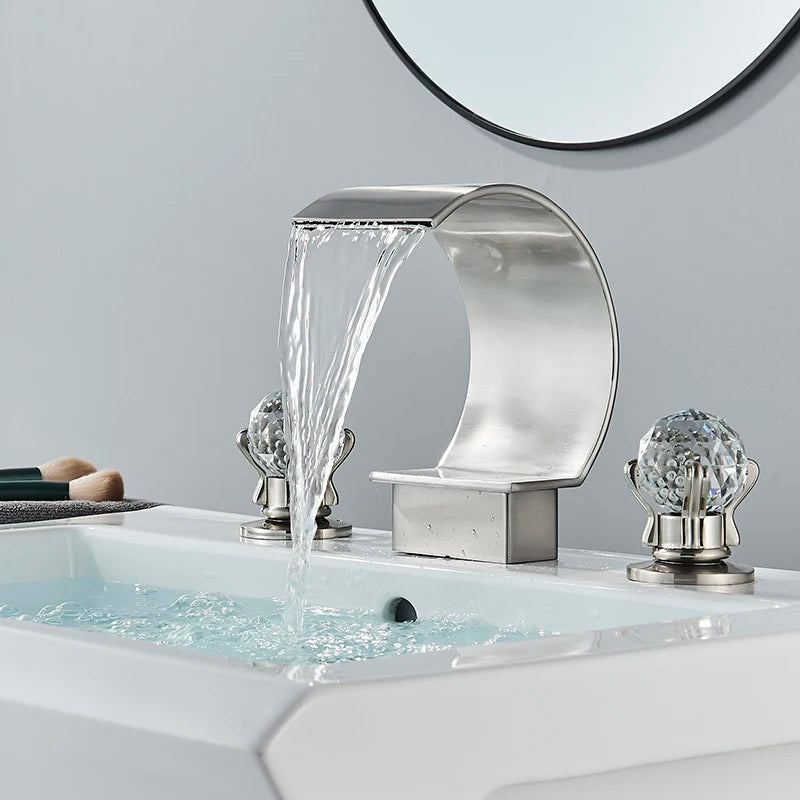 Elegant waterfall basin faucet with crystal handles by MC THE BLACK DIAMOND, designed for bath sinks with a modern aesthetic.