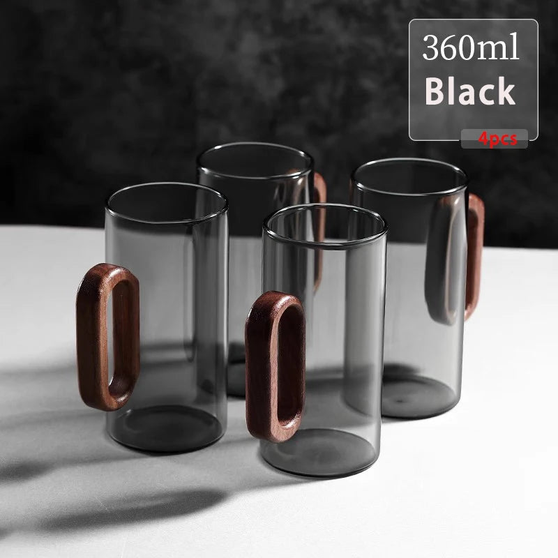 Glass mug with wooden handle from MC THE BLACK DIAMOND drinkware set, perfect for hot beverages, featuring clear glass and natural wood handle.
