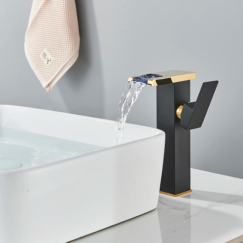 LED temperature-display basin faucet by MC THE BLACK DIAMOND, mounted on a modern bath sink with a sleek design.