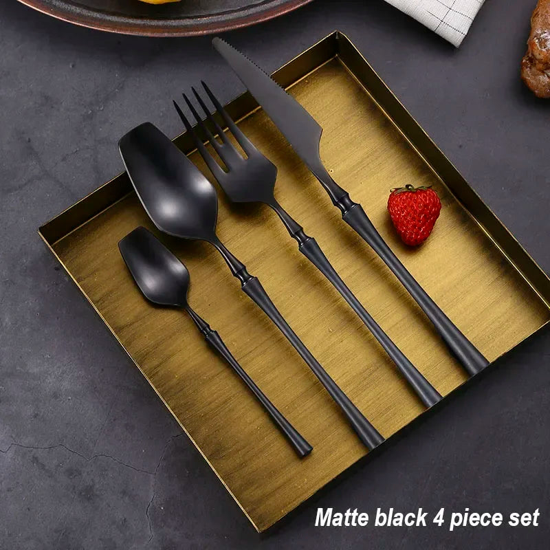 Mirror matte stainless steel black, gold, and silver dinnerware set with reflective finishes and elegant design.