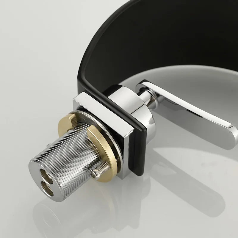 Black and white hot and cold water hydrant iron bathroom sink tap by MC THE BLACK DIAMOND, with modern design for bath sinks.