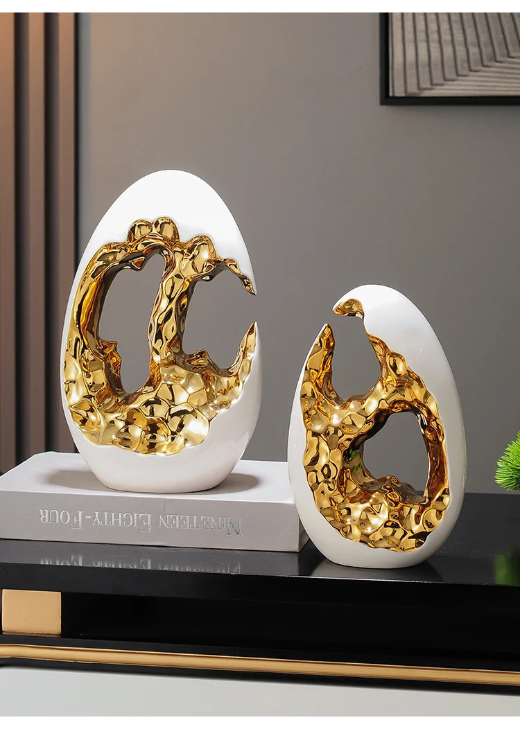 Gold ornaments figurines in decor placed on a TV cabinet and office desktop, by MC THE BLACK DIAMOND, for living room or workspace decor.