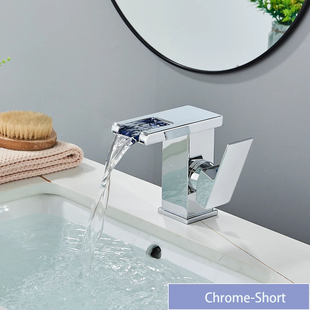 Black LED bathroom sink faucet by MC THE BLACK DIAMOND, brass waterfall mixer with hot and cold water controls.
