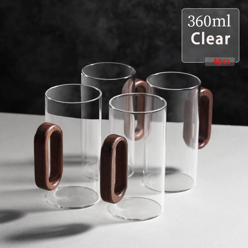 Glass mug with wooden handle from MC THE BLACK DIAMOND drinkware set, perfect for hot beverages.
