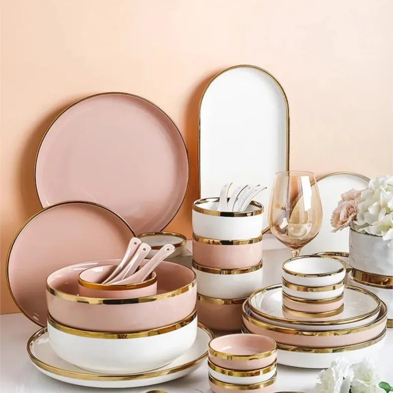 Set of bright white and pink porcelain plates with gold accents from MC THE BLACK DIAMOND for elegant kitchen table settings.