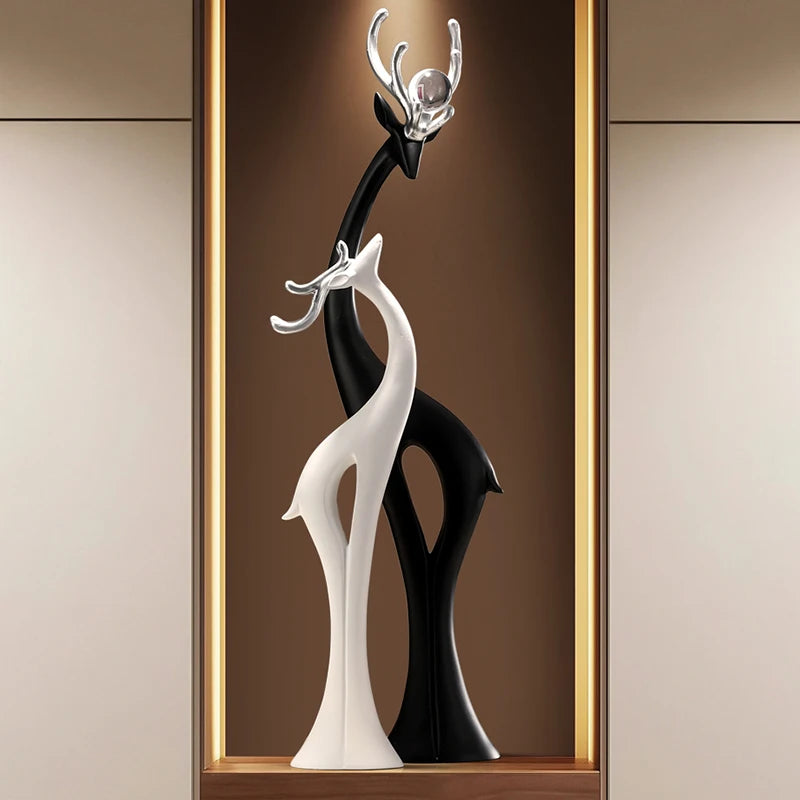 Modern MC THE BLACK DIAMOND deer figurine ornament for home decor, featuring a sleek, stylish couple design on a light luxury living room display