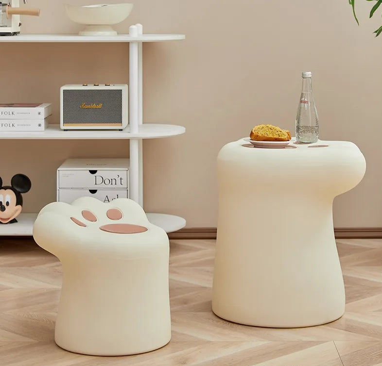 Cream-colored MC THE BLACK DIAMOND coffee table with a sleek end table design, perfect for a modern living room setting.
