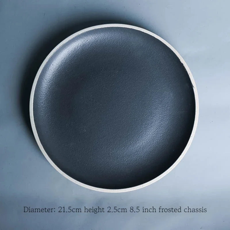 Deep black family dinner set by MC THE BLACK DIAMOND featuring matching plates, bowls, and cups for elegant dining.