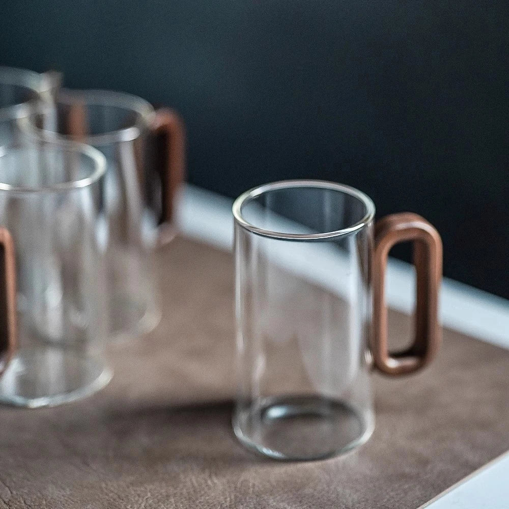 Glass mug with wooden handle from MC THE BLACK DIAMOND drinkware set, showcasing a stylish, heat-resistant design.
