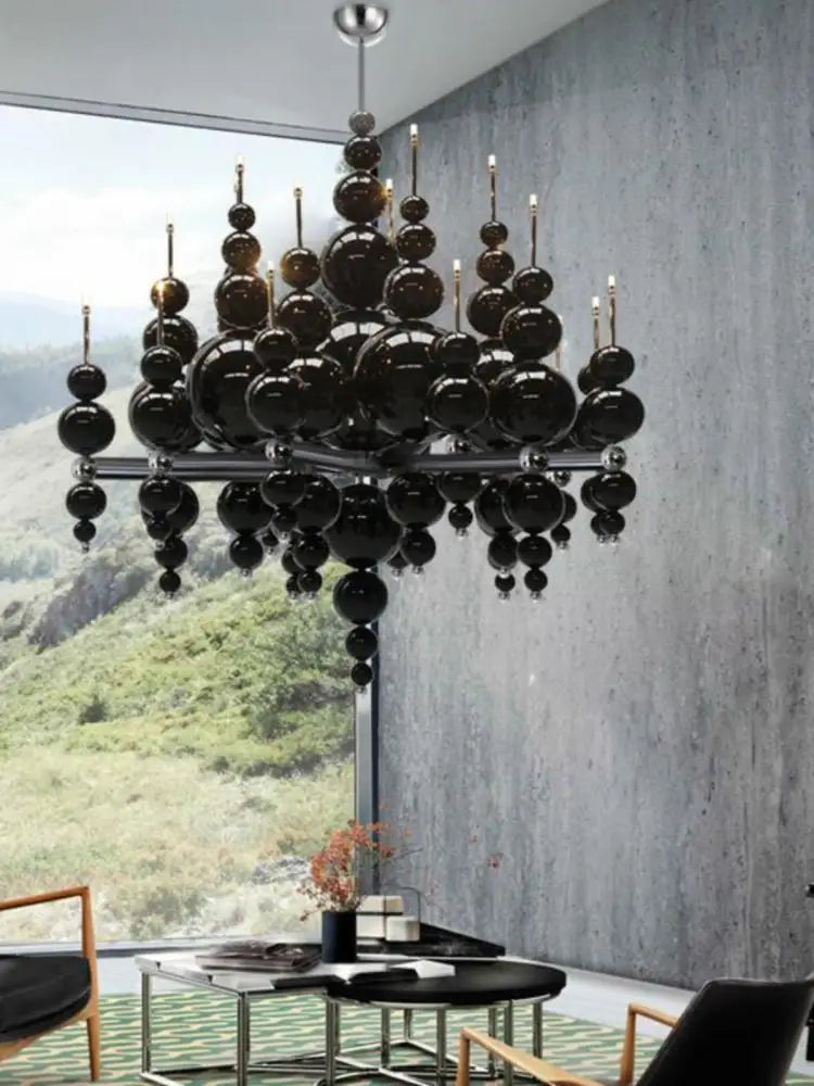 Black chandelier by MC THE BLACK DIAMOND featuring multiple elegant arms and crystal accents, ideal for luxury living room lighting.
