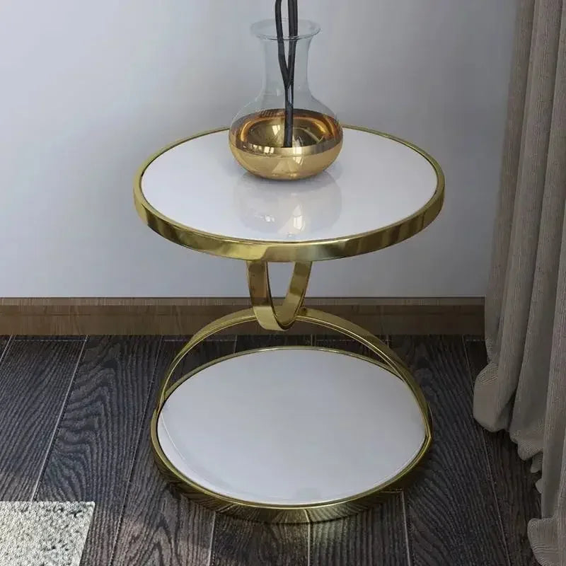 Modern round end table with glass top and stainless steel frame, crafted by MC THE BLACK DIAMOND.