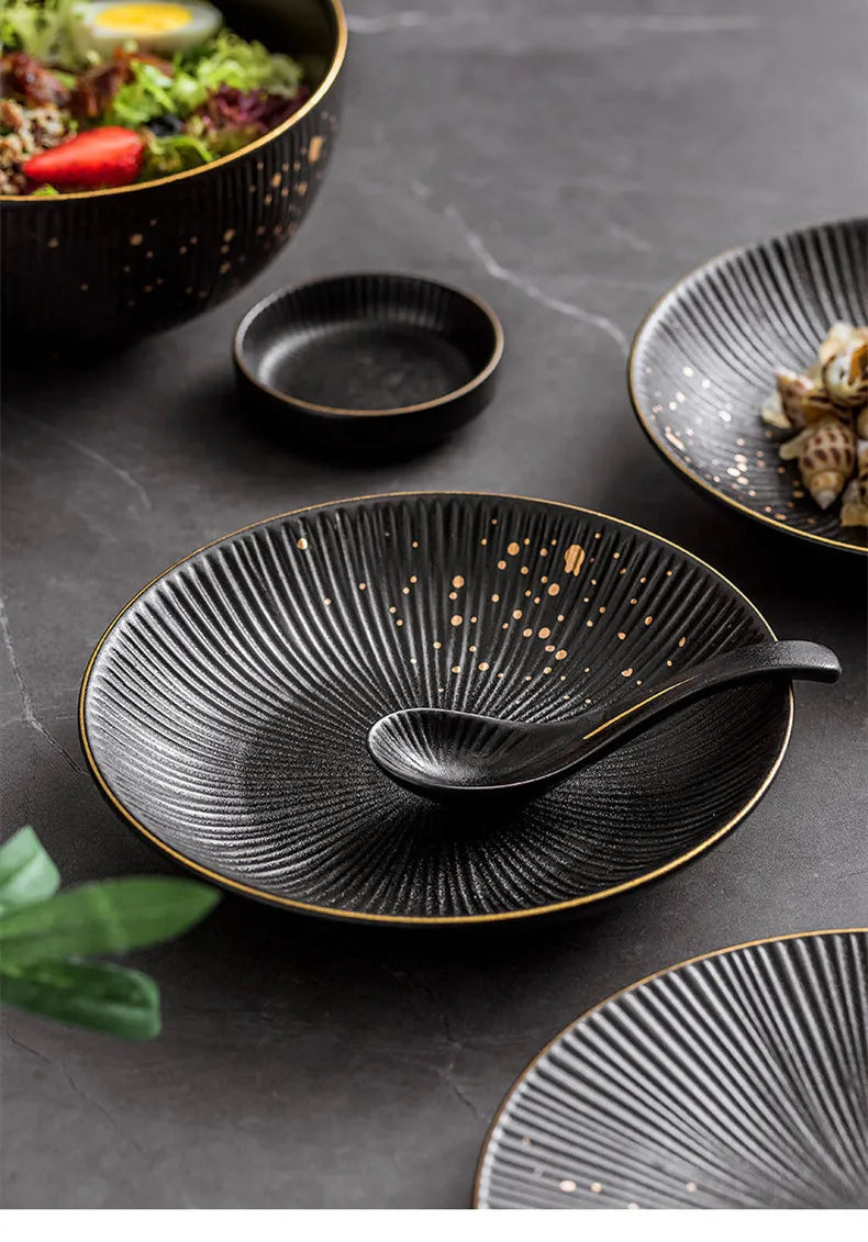 Ceramic dinnerware set by MC THE BLACK DIAMOND including bowls, plates, and cutlery for kitchen and table use.