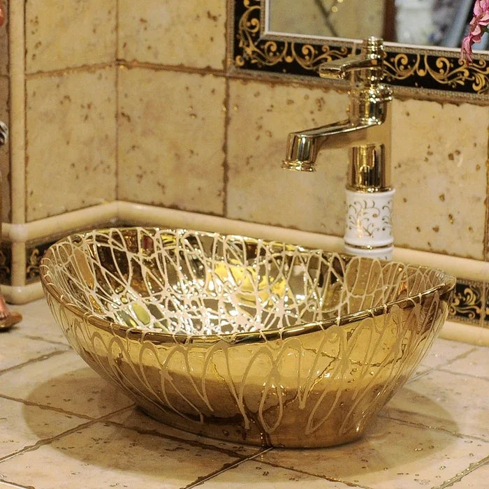 Oval ceramic bathroom wash basin by MC THE BLACK DIAMOND, vessel sink with smooth, glossy finish and modern design.