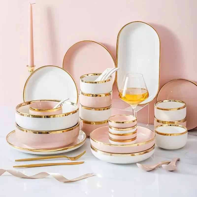 Set of bright white and pink porcelain plates with gold accents from MC The Black Diamond for elegant kitchen use.