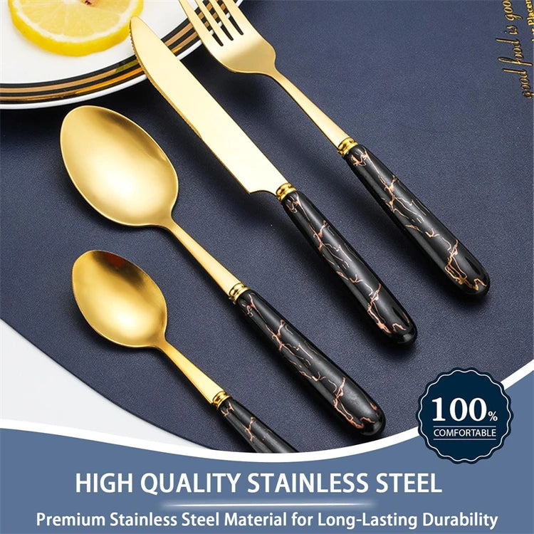 MC THE BLACK DIAMOND stainless steel flatware set with knives, forks, and spoons arranged on a dining table.