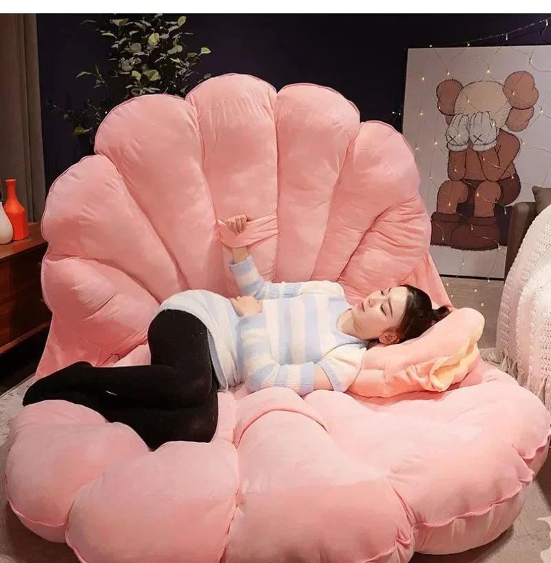 Large clam shell-shaped plush cushion from MC THE BLACK DIAMOND, designed as a soft seashell sofa pillow for kids' beds.