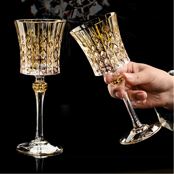 Gold crystal glass red cup from MC THE BLACK DIAMOND drinkware set, showcasing a sleek, elegant design with a transparent crystal finish.
