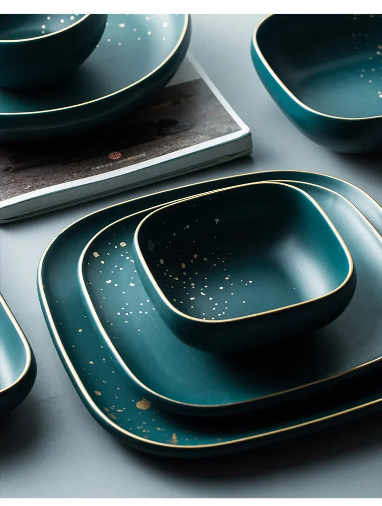 Dark green ceramic Western dinnerware set by MC THE BLACK DIAMOND, includes plates and bowls with a sleek Nordic design.