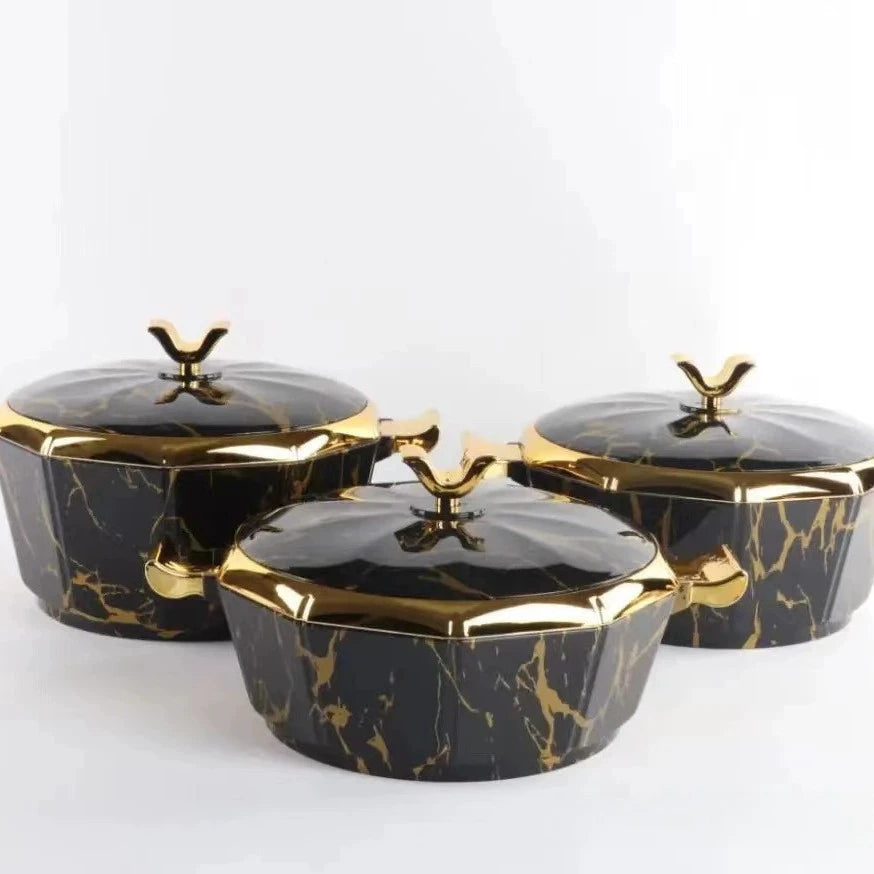 Set of three MC THE BLACK DIAMOND food warmers and casseroles, designed to keep dishes hot and fresh.