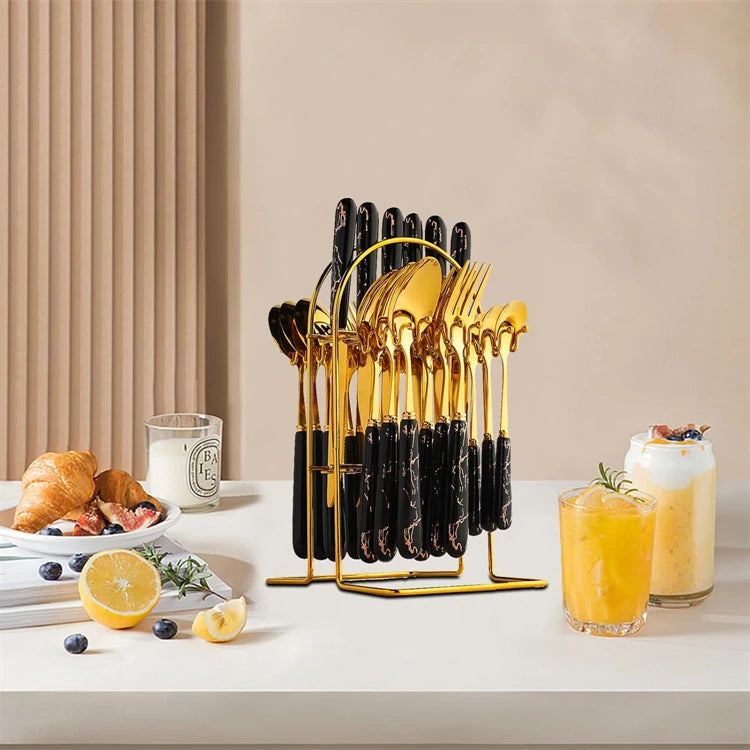 Stainless steel flatware set with knives, forks, and spoons from MC THE BLACK DIAMOND, neatly arranged on a table.
