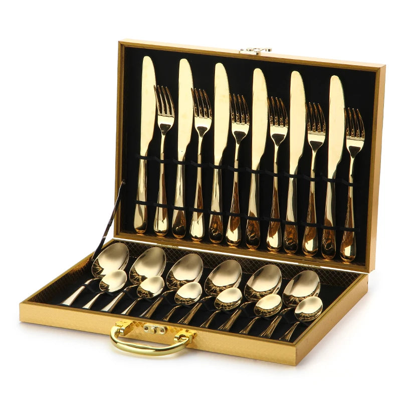 MC THE BLACK DIAMOND golden flatware set with cutlery dishes, featuring sleek, polished design for elegant dining.