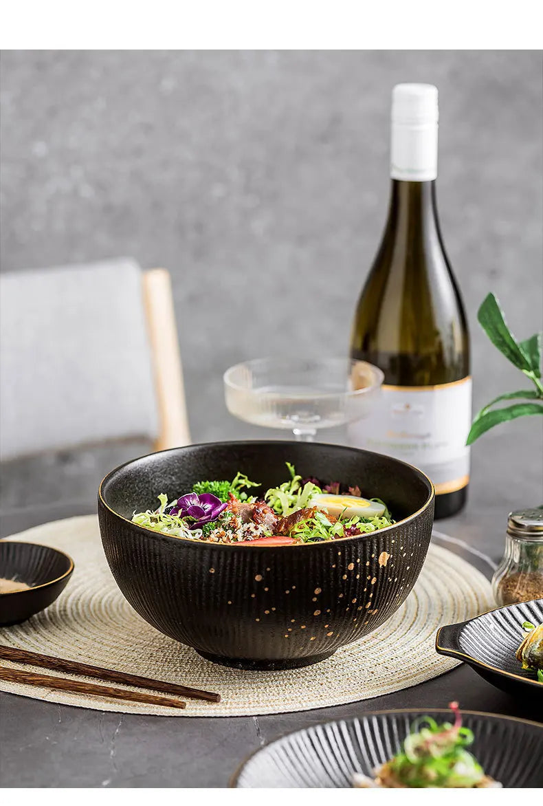Ceramic dinnerware set with bowls and cutlery from MC THE BLACK DIAMOND, featuring sleek modern design for kitchen table.