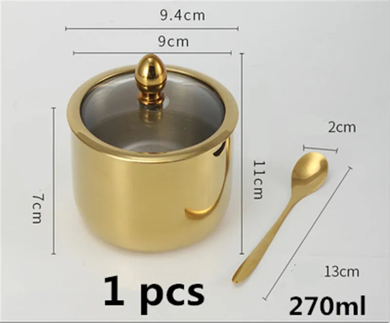 MC The Black Diamond golden seasoning box with glass cap, spoon, and flavoring tank for kitchen use.
