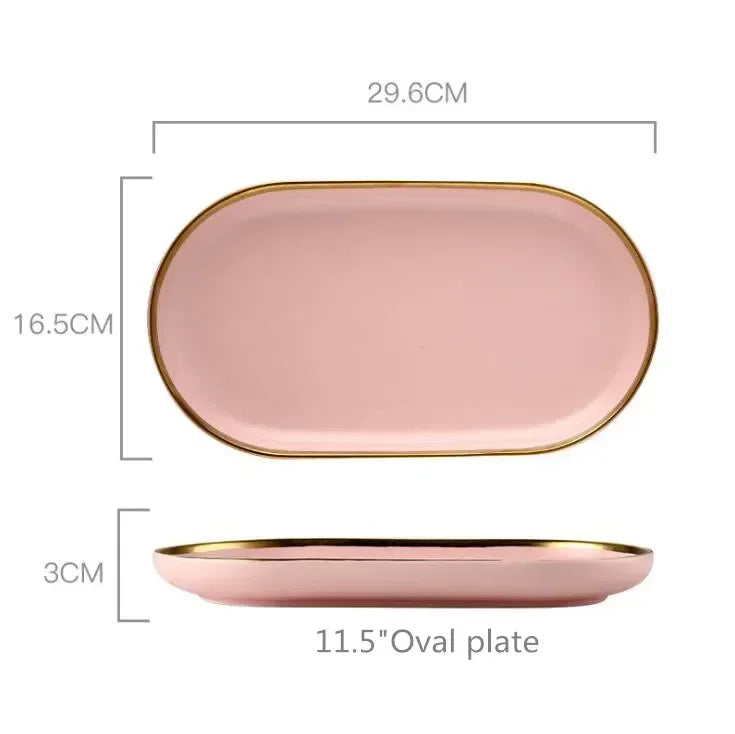 Set of MC THE BLACK DIAMOND ceramic dinnerware including plates, bowls, and mugs arranged on a kitchen table.